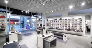 bright and fashionable interior of shoe store in modern mall